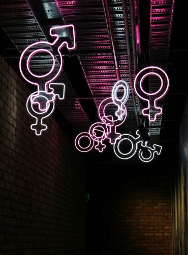 Neon gender symbols – a combination of Mars (male) and Venus (female) Neon gender symbols - a combination of Mars (male) and Venus (female)